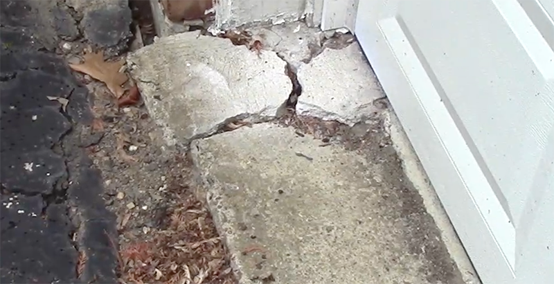 cracks in concrete around the garage